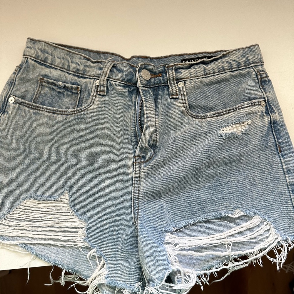 Distressed Blank denim shorts.